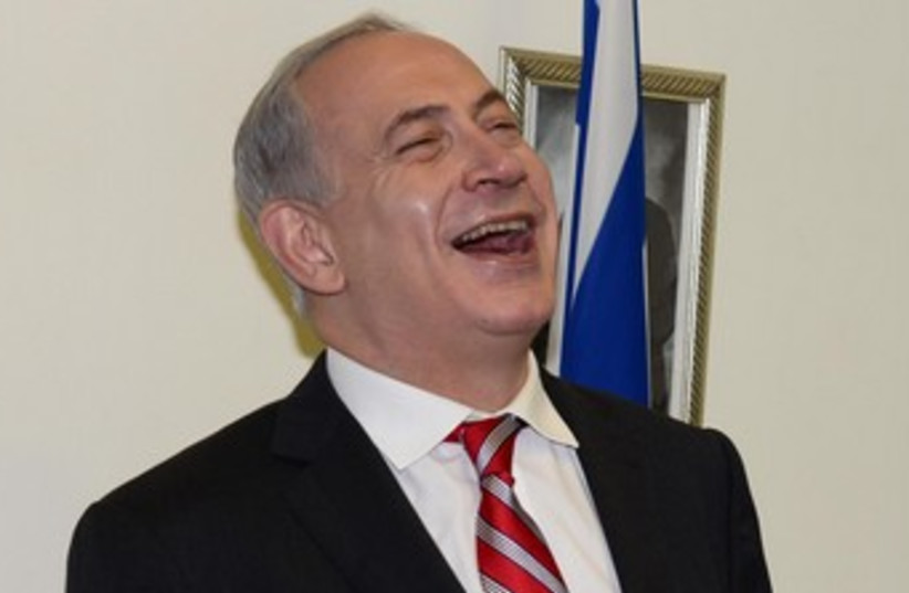 Bibi laughing hysterically 370 (photo credit: Moshe Milner GPO)