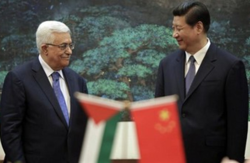 China's President Xi Jinping (R) and his Palestinian counter (photo credit: REUTERS/Jason Lee)