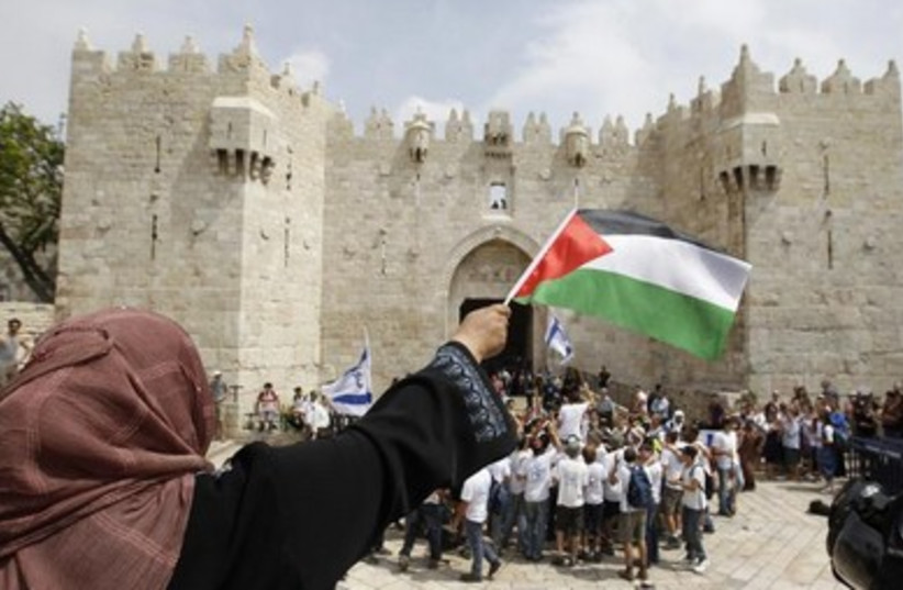 A Palestinian woman protests Jerusalem Day festivities