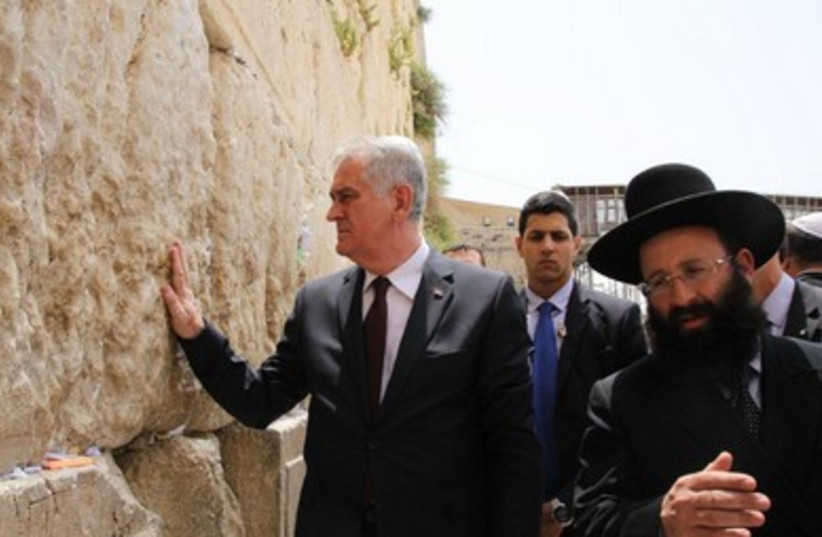 Serbian President Tomislav Nikolic takes a moment at the Western Wall