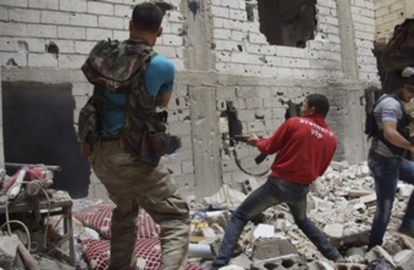 firefight in syria 370 (photo credit: REUTERS)