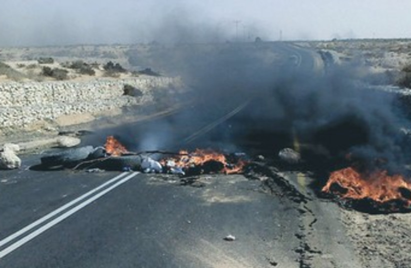 CAR TIRES set alight by masked Beduin burn on Negev highway  (photo credit: Courtesy MK Ayelet Shaked’s office)