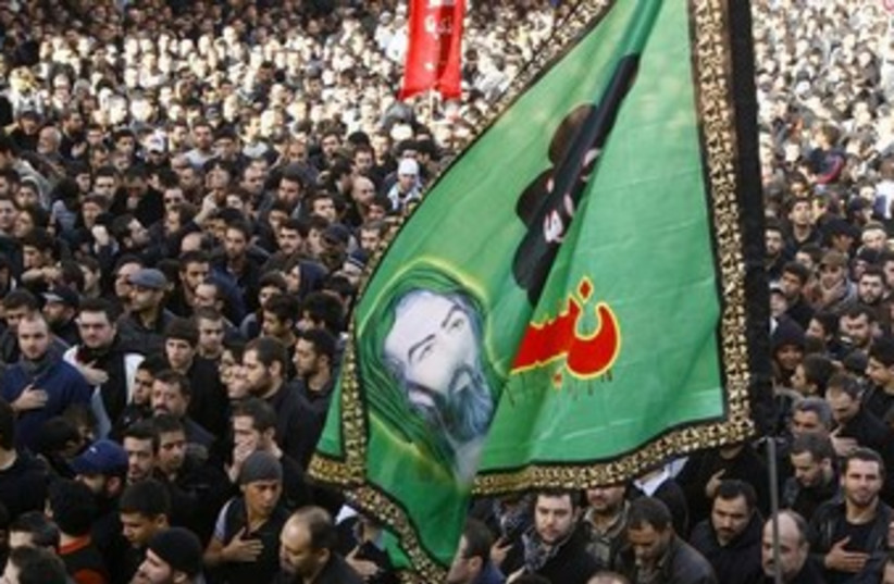 Hezbollah supporters (photo credit: Reuters/Khalil Hassan)