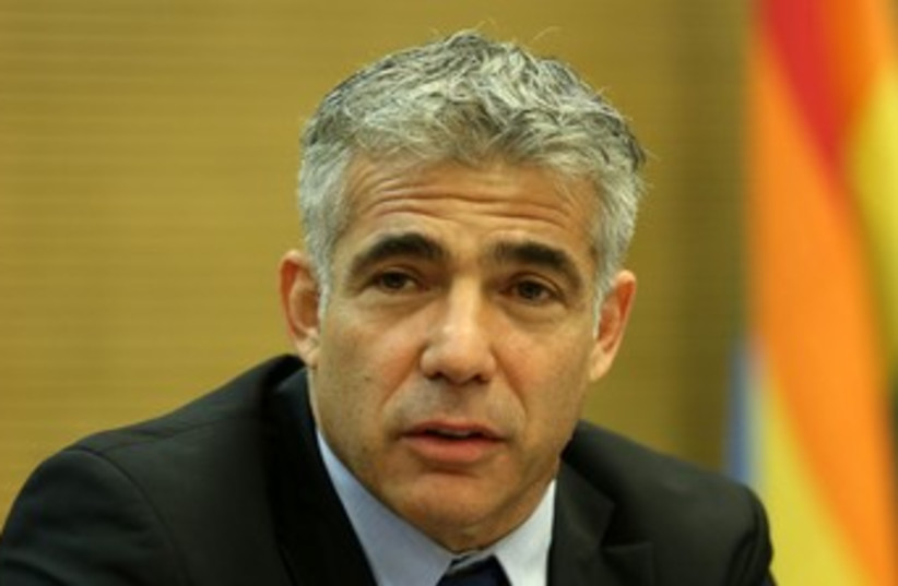 Yair Lapid with gay flag 370 (photo credit: Yair Lapid at meeting in Knesset, 3 June 2013.)