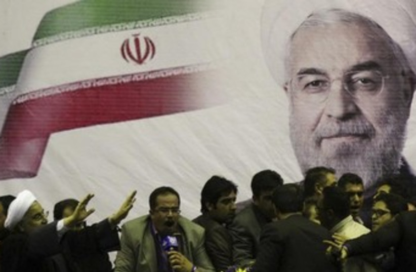 Iranian presidential candidate Hassan Rohani (L) mural 370 (photo credit: REUTERS)