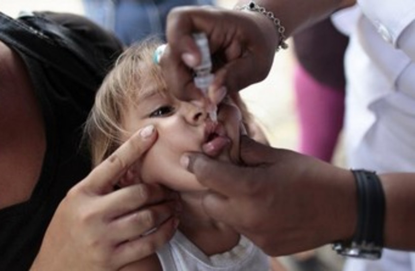 polio vaccine illustrative 370 (photo credit: REUTERS/Oswaldo Rivas)