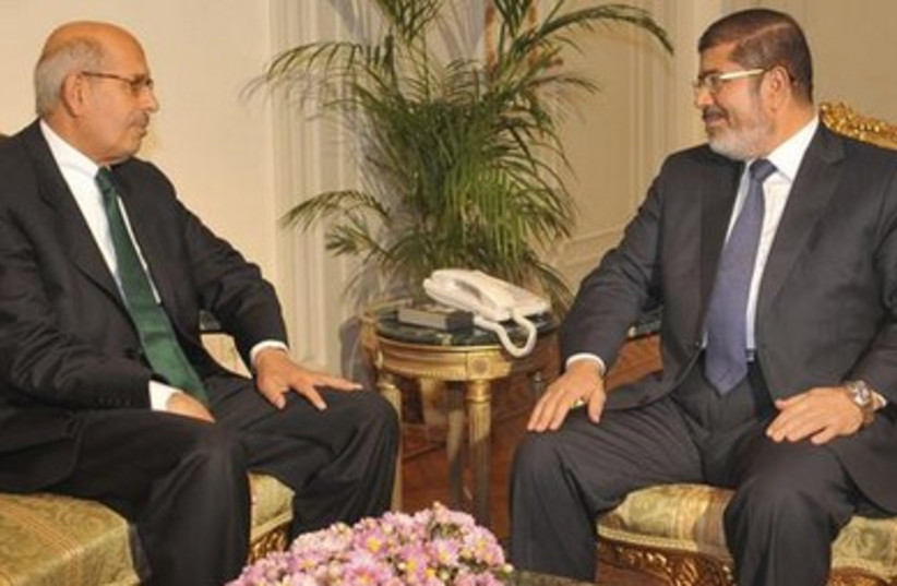 Mohamed Elbaradei (L) and deposed president Mohamed Morsi in Novermber, 2012.