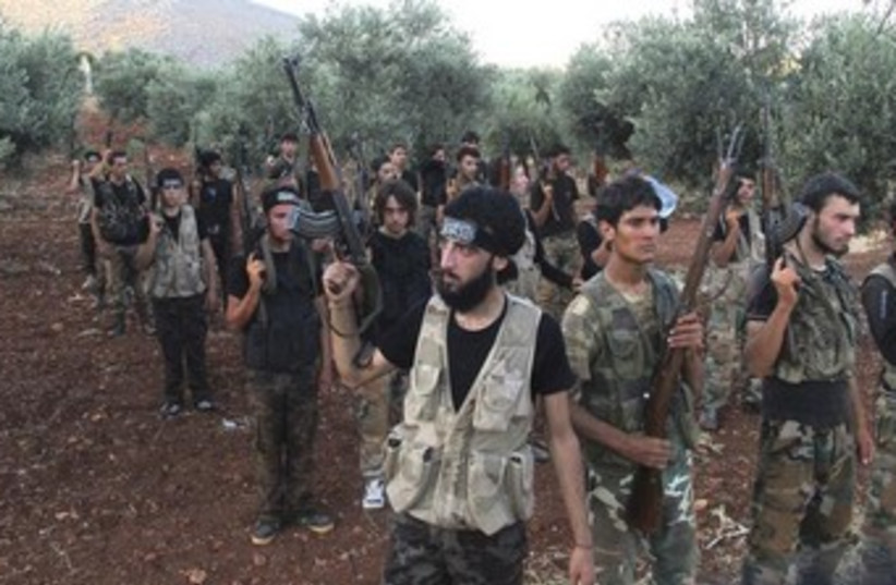 Syrian oppositionists fighting the Assad regime370 (photo credit: Reuters)