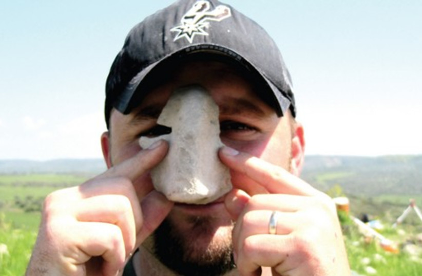 The nose piece from a Canaanite facemask found at the site (photo credit: Courtesy)