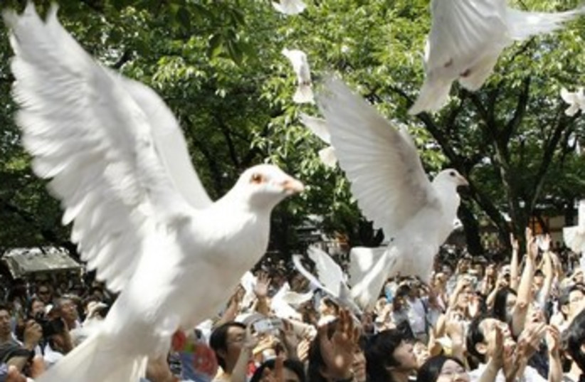 Doves flying 370 (photo credit: REUTERS)