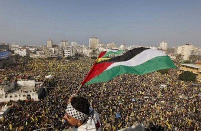 Palestinians in Gaza celebrate the founding of Fatah 370 (photo credit: Reuters)