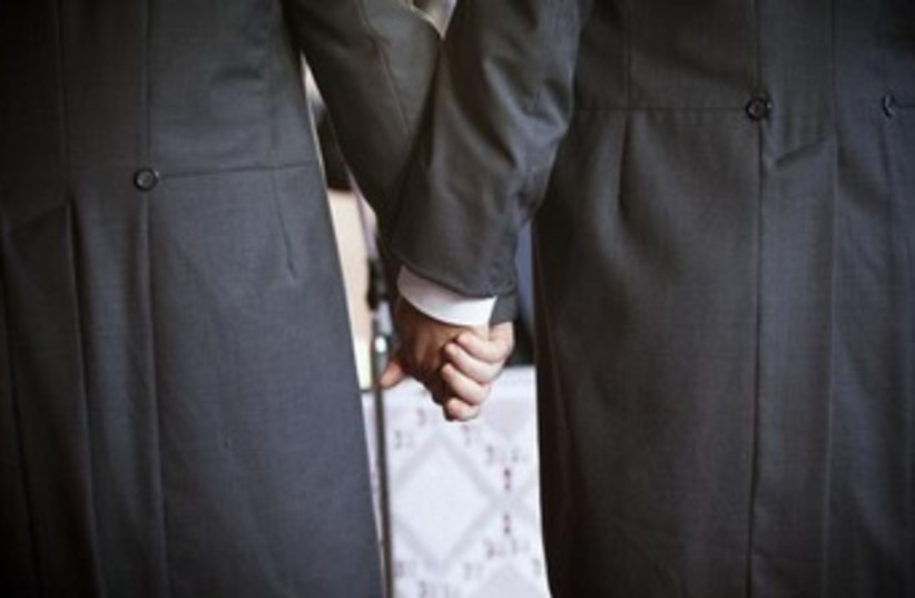 Gay wedding holding hands 370 (photo credit: REUTERS/Pepe Marin)
