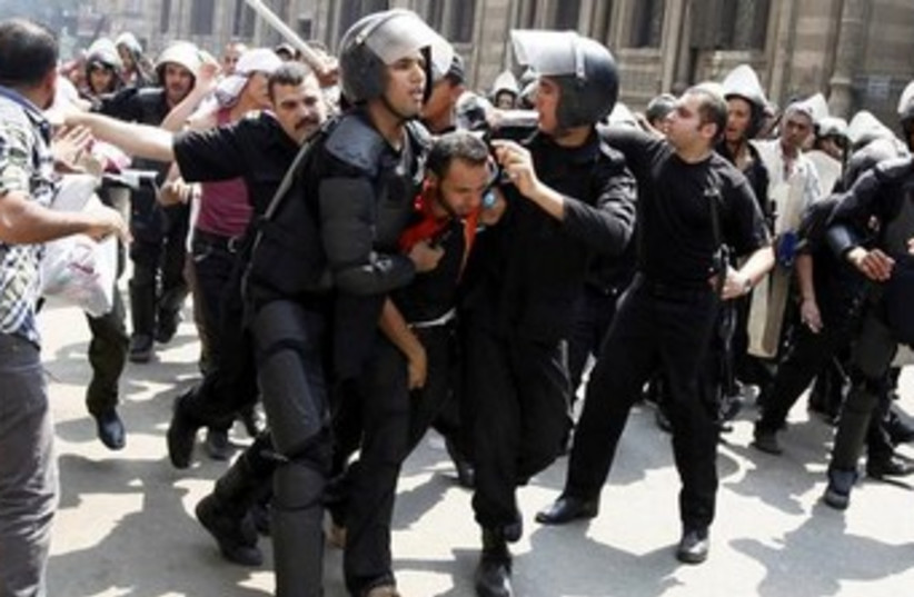 egyptian police arrest brotherhood supporter 370 (photo credit: REUTERS)