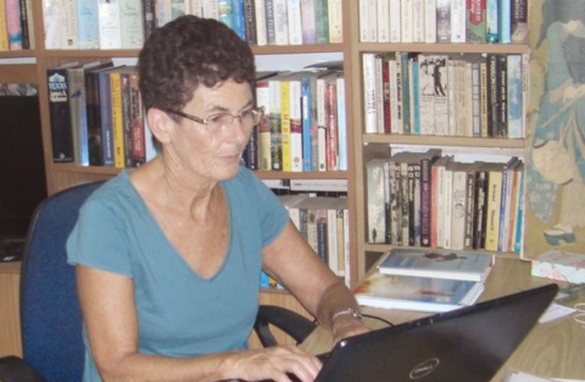 Beryl Belsky sits at her laptop 521 (photo credit: Courtesy)