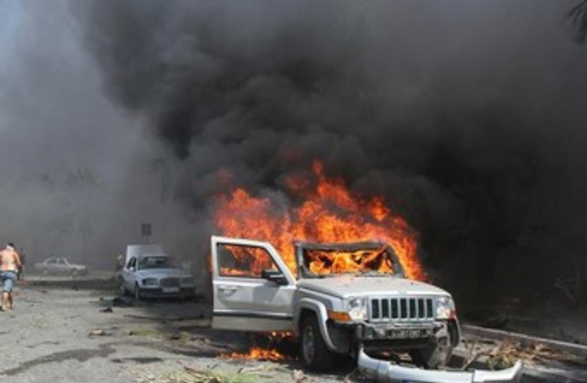 Scene of bombing in northern Lebanese town of Tripoli 370 (photo credit: Reuters)