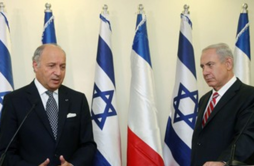 Netanyahu looking menacingly at French FM Fabius 370 (photo credit: Marc Israel Sellem/The Jerusalem Post)