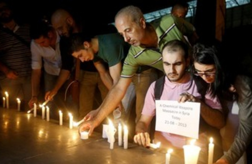 syrian mourn those killed in chemical weapons attack 370 (photo credit: REUTERS)