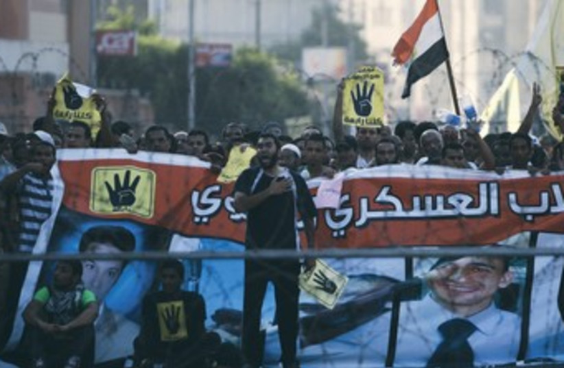 Muslim Brotherhood supporters protest in Cairo 370 (photo credit: Amr Abdallah Dalsh/Reuters)