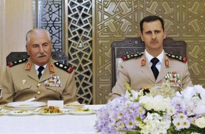 Assad and former Syrian defense minister Ali Habib 370 (photo credit: REUTERS/Sana)