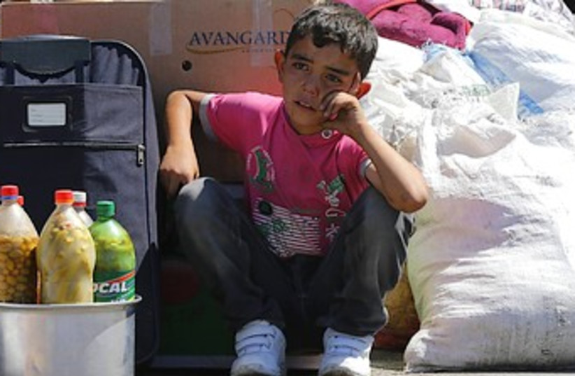 Syrian child refugee in Turkey 370 (photo credit: Reuters)