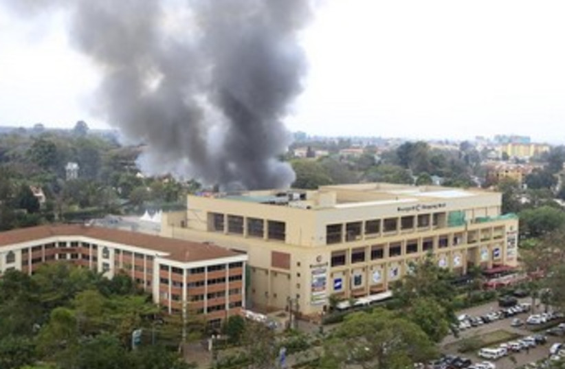 Smoke rises from the Westgate shopping centre (photo credit: Reuters)