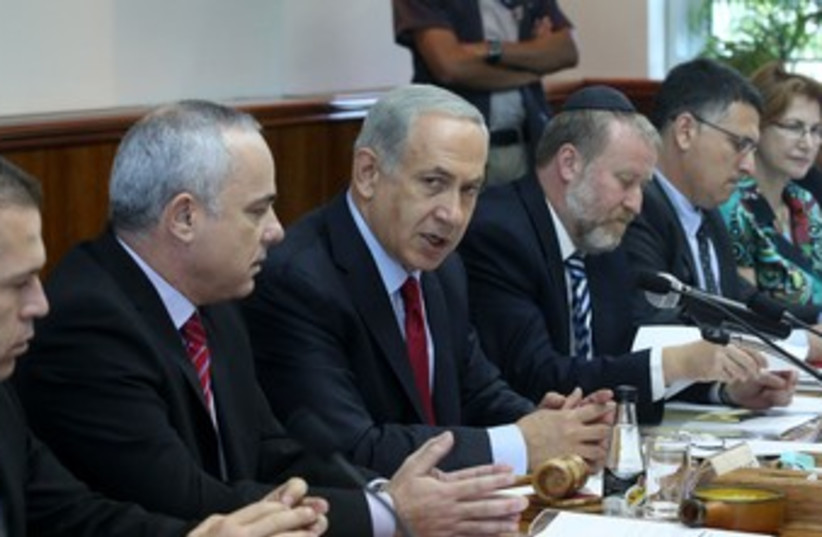 netanyahu at cabinet meeting gestures 370 (photo credit: Marc Israel Sellem/The Jerusalem Post)