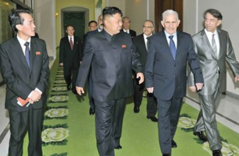 Kim Jong-uh and syrian guy 370 (photo credit: Reuters/KCNA)
