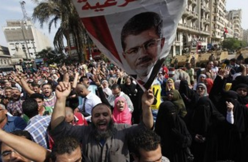 Morsi supporters outside Cairo High Court 370 (photo credit: REUTERS/Mohamed Abd El Ghany )