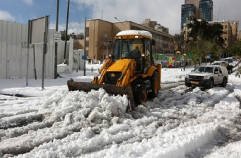 Tractor clearing road from snow in J'lem 370 (photo credit: Marc Israel Sellem/The Jerusalem Post)