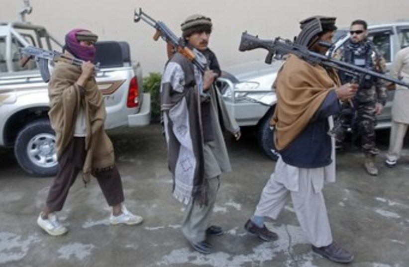Taliban militants with weapons 370 (photo credit: REUTERS/Parwiz)