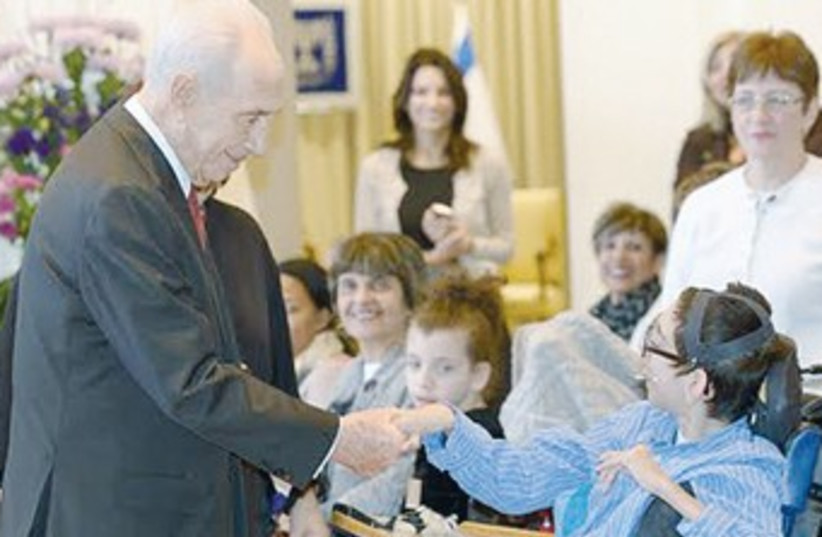 President Shimon Peres with youngsters from ILAN (photo credit: Mark Neiman/GPO)
