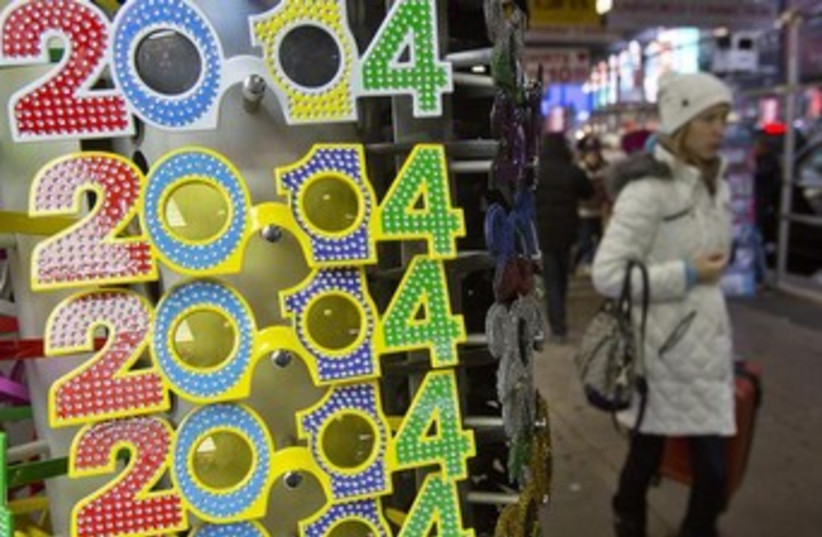 Rack of novelty glasses for New Year's Eve in New York City. (photo credit: Reuters)