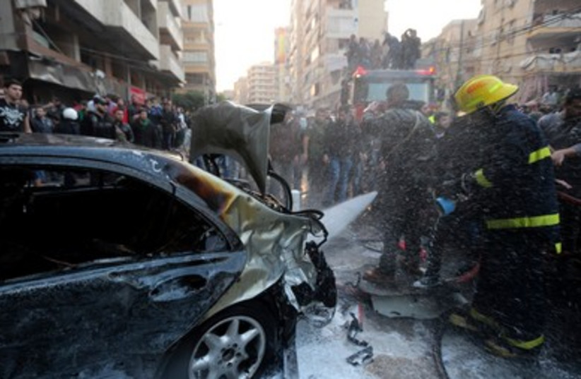 Firefighters at the scene of a blast in Beirut. (photo credit: REUTERS/Hasan Shaaban )