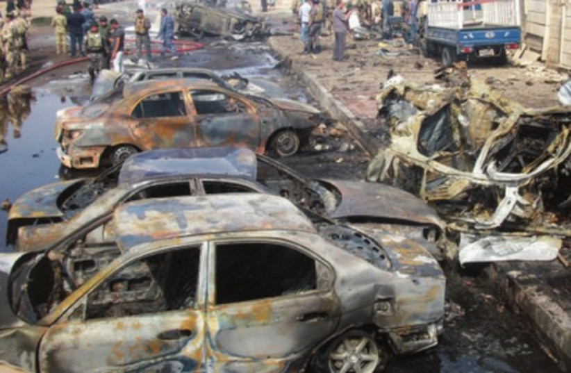 A car bomb attack against Shi'ite mosques in Baghdad (photo credit: WISSM al-okil/ reuters)