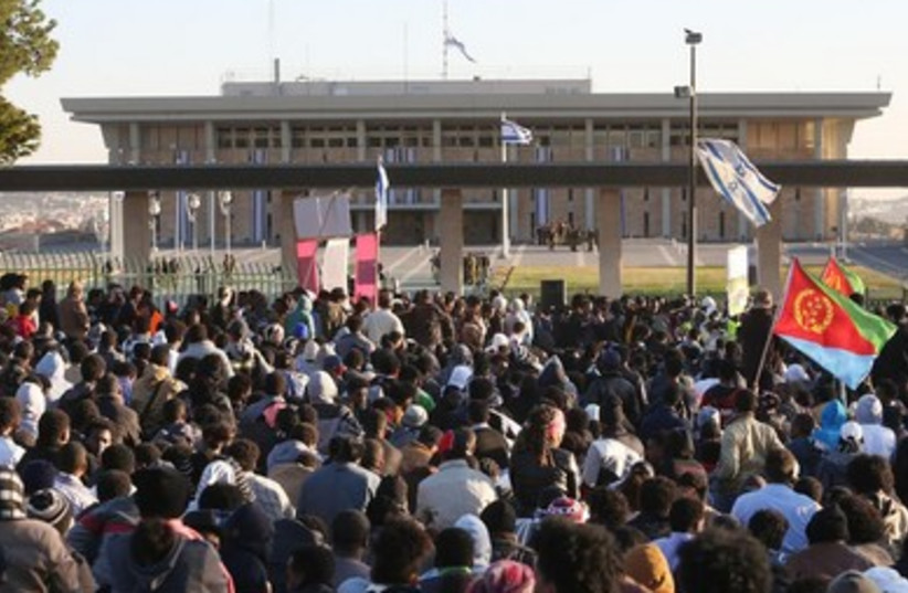 African migrants protest in front of the Knesset, January 8, 2014. (photo credit: Marc Israel Sellem/The Jerusalem Post))