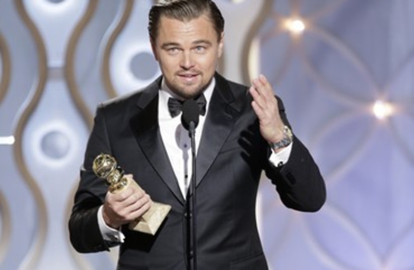 Leonardo DiCaprio accepts his Golden Globe. (photo credit: reuters)