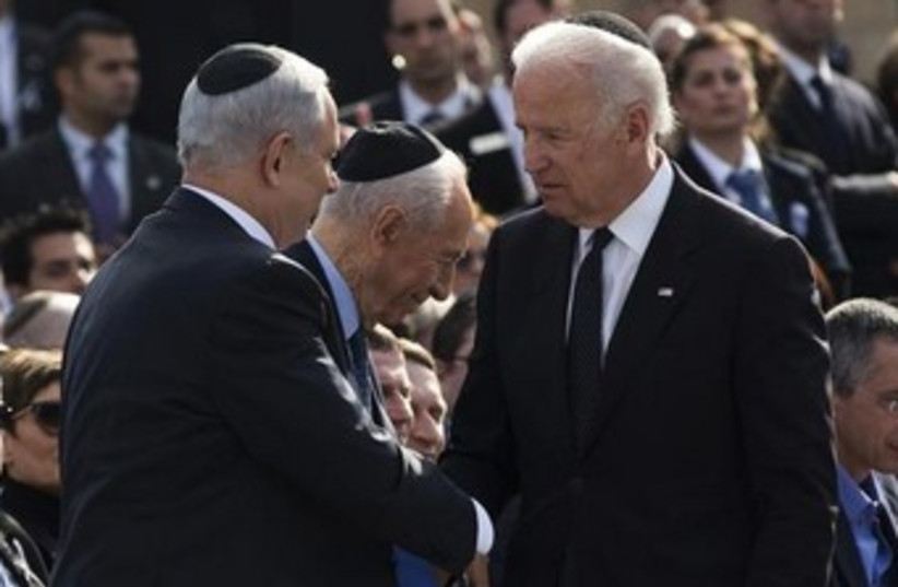 Prime Minister Netanyahu and US Vice President Biden at a Knesset memorial service for Ariel Sharon, January 13, 2014 (photo credit: REUTERS/Darren Whiteside)
