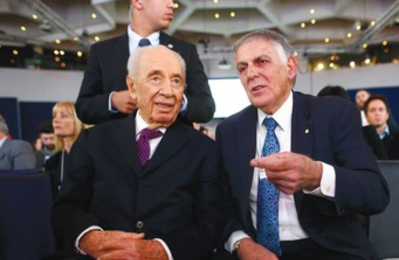 PRESIDENT SHIMON PERES speaks with Technion professor Dan Shechtman before a session at the annual meeting of the World Economic Forum in Davos. (photo credit: REUTERS)