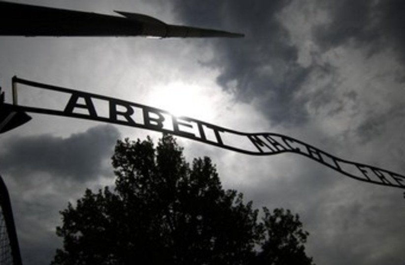 The sign "Arbeit macht frei" at the main gate to the Auschwitz concentration camp. (photo credit: REUTERS)
