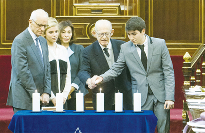 Isaac Revah a Bergen Belsen survivor lit a candle in the Spanish Senate in Madrid (photo credit: CENTRO SEFARD-ISRAEL)