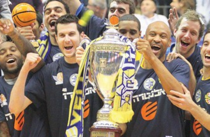 Maccabi Tel Aviv celebrates its State Cup triumph (photo credit: ADI AVISHAI)
