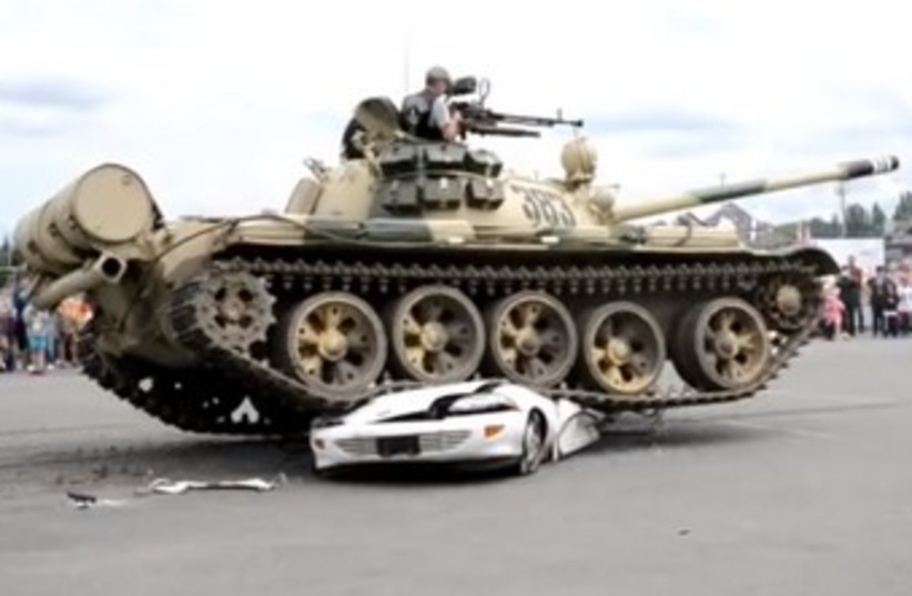 Tank parks on top of car (illustrative) (photo credit: YOUTUBE SCREENSHOT)