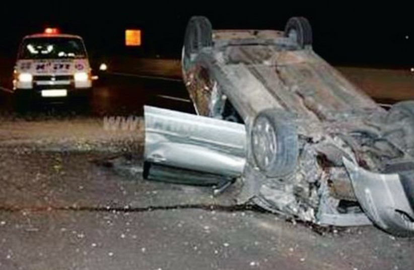 David Sameach was driving along the Geha Road around 3 a.m. after a party, when his car hit a security barrier and flew up into the air. (photo credit: Courtesy)