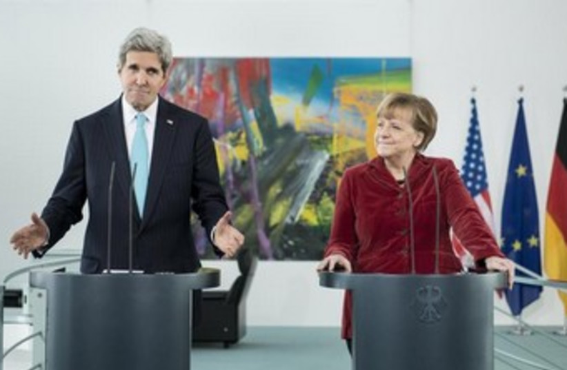 US Secretary of State John Kerry and German Chancellor Angela Merkel in Berlin, January 31, 2014. (photo credit: REUTERS)