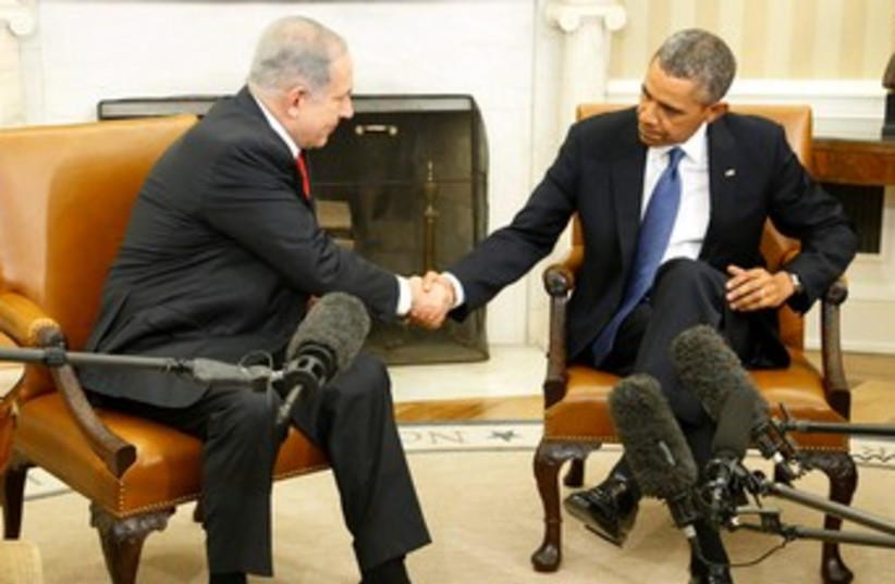 Netanyahu and Obama shake hands at start of Oval Office meeting, March 3, 2013 (photo credit: REUTERS)