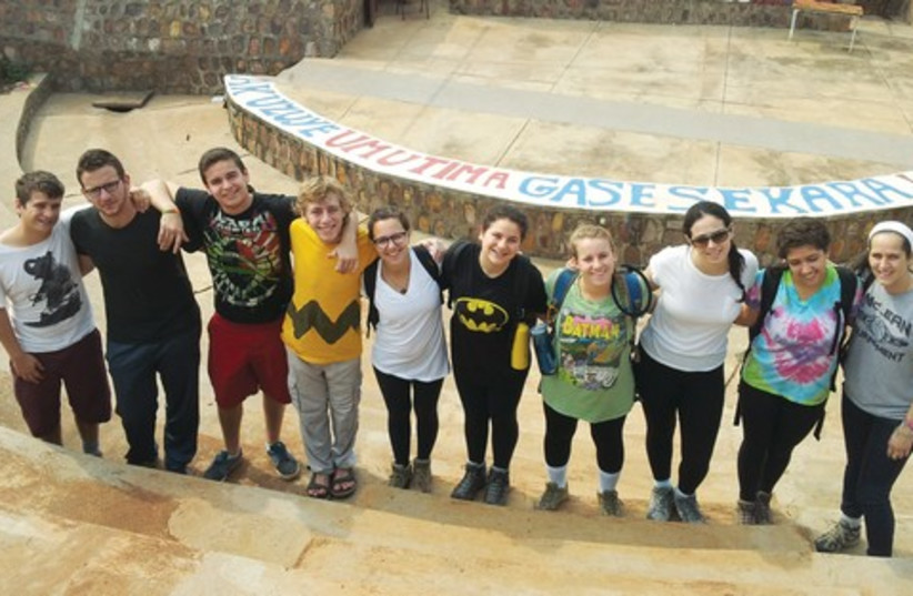 YOUNG JUDAEA volunteers on their week at the Agahozo-Shalom Youth Village with Yoni Merrin (fourth from left), Anne Heyman’s son. (photo credit: YOUNG JUDEA)