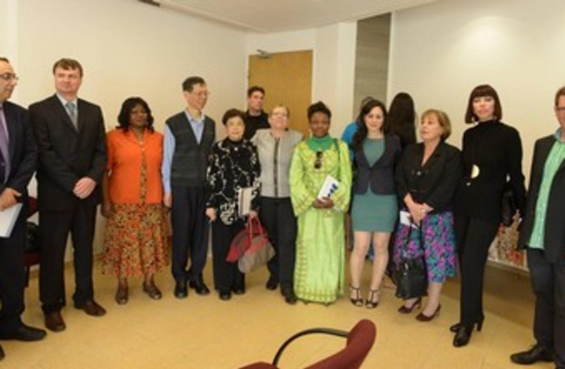 Foreign dignitaries tour the NA'AMAT Glickman Center for the Prevention and Treatment of Domestic Violence in the Family in Tel Aviv on Thursday (photo credit: GPO)