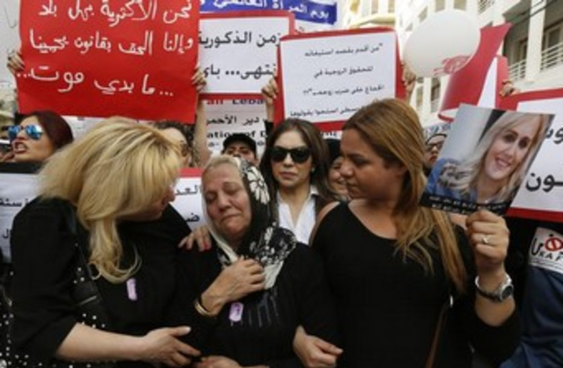 A march against domestic violence against women, marking International Women's Day in Beirut March 8, 2014. (photo credit: REUTERS)