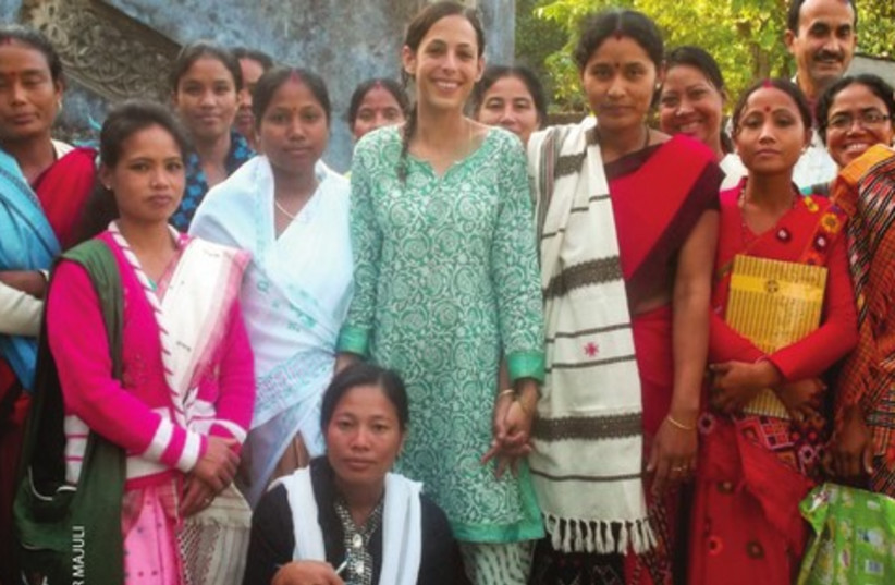 Gili Navon (center) with the artisans who founded the Rengam Mising weaver cooperative in India (photo credit: COURTESY AMAR MAJULI)