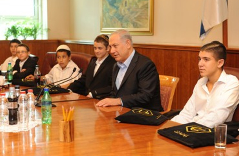 Prime Minister Binyamin Netanyahu with orphaned bar mitzva boys